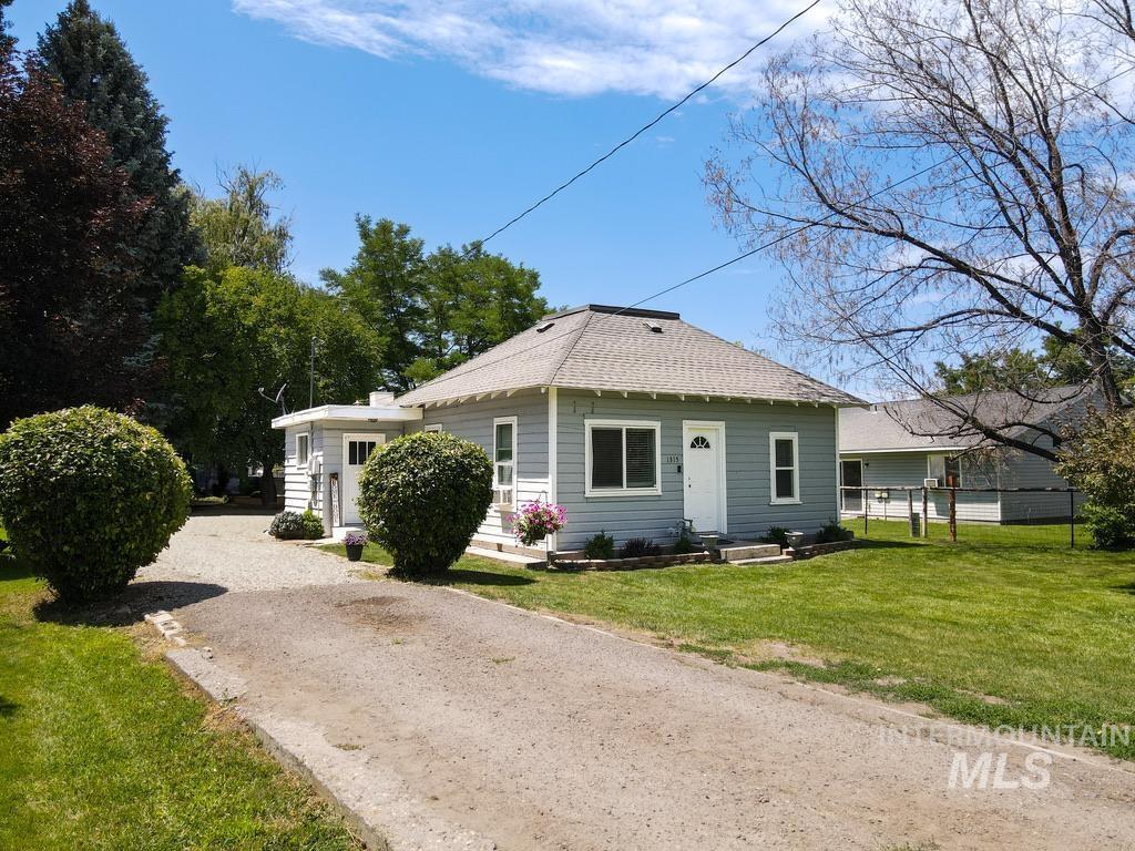 1315H St, Rupert, ID 83350 - view of front of home featuring gravel driveway and a shingled roof