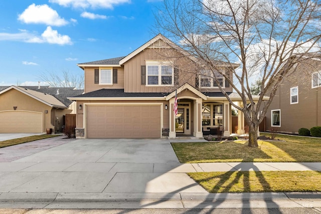 view of front facade featuring board and batten siding, an attached garage, driveway, and a front yard