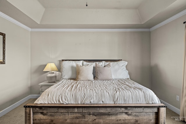 bedroom featuring a raised ceiling, crown molding, carpet, and baseboards