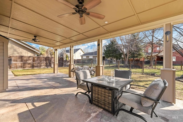 view of patio / terrace featuring a fenced backyard, a ceiling fan, and outdoor dining space