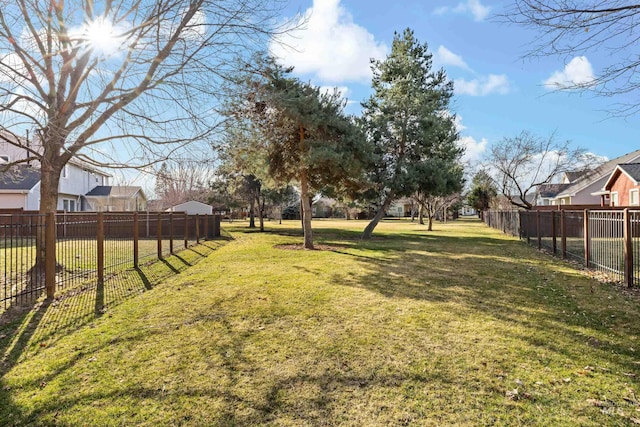 view of yard with fence and a residential view