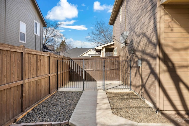 view of home's exterior featuring a gate and fence