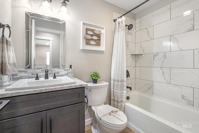 bathroom with vanity, toilet, and shower / bathtub combination with curtain