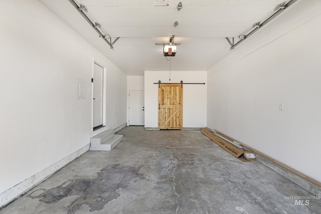 garage with baseboards and a garage door opener