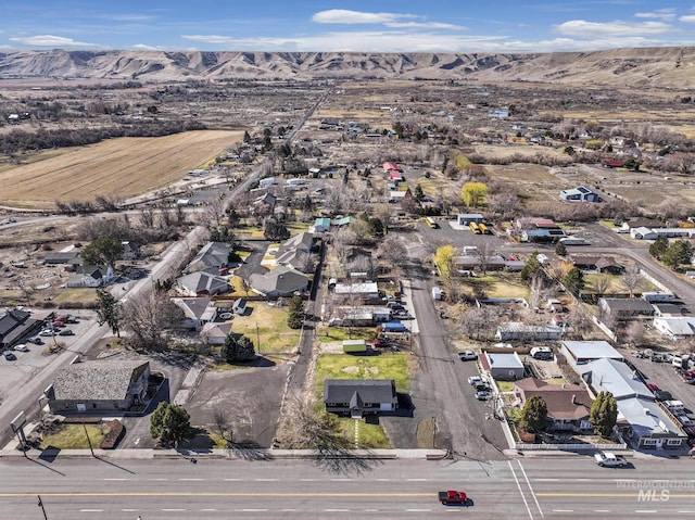 birds eye view of property featuring a mountain view