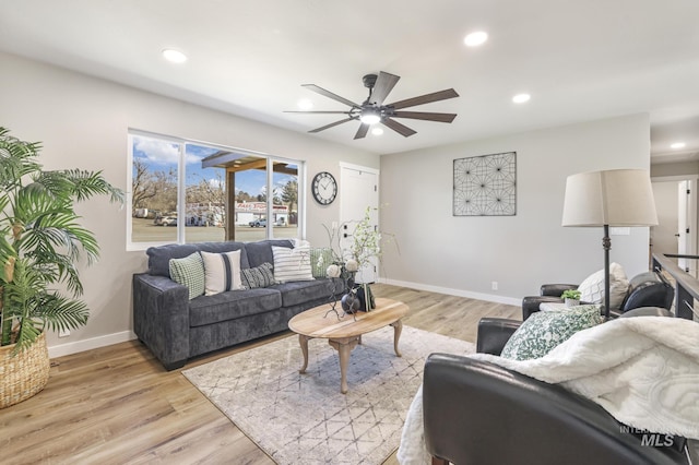 living area featuring recessed lighting, baseboards, ceiling fan, and light wood finished floors