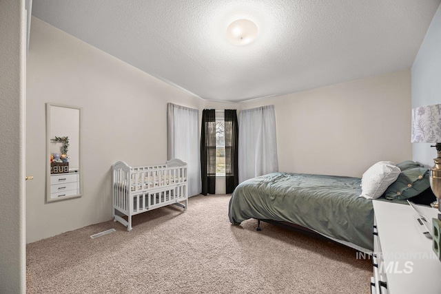 529 S State St, Nampa, ID 83686 - carpeted bedroom featuring a textured ceiling