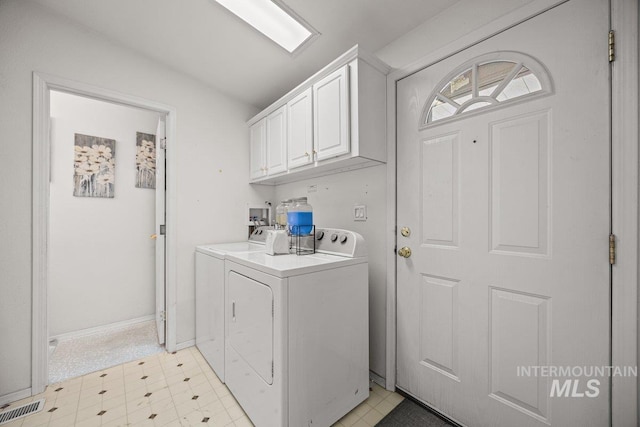 529 S State St, Nampa, ID 83686 - washroom featuring washer and dryer, light flooring, cabinet space, and baseboards