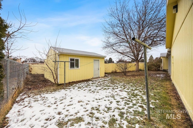 529 S State St, Nampa, ID 83686 - snowy yard with a fenced backyard and an outdoor structure