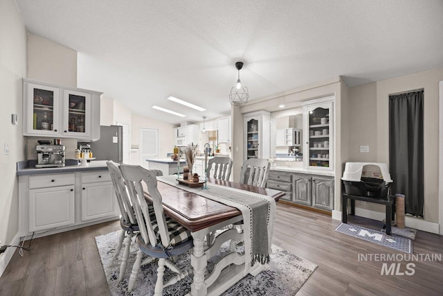 529 S State St, Nampa, ID 83686 - dining space featuring light wood-style floors and a textured ceiling