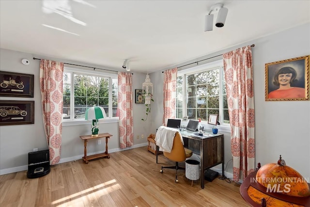 office with wood finished floors and baseboards