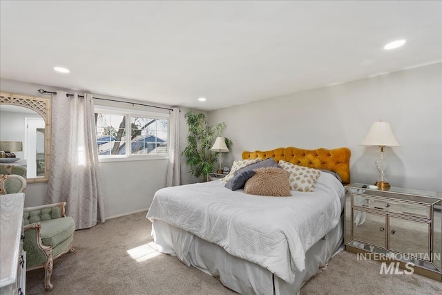 bedroom featuring light carpet and recessed lighting