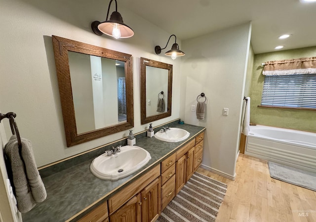1223 Forest Rd, Winchester, ID 83555 - bathroom with wood finished floors, a bath, and double vanity