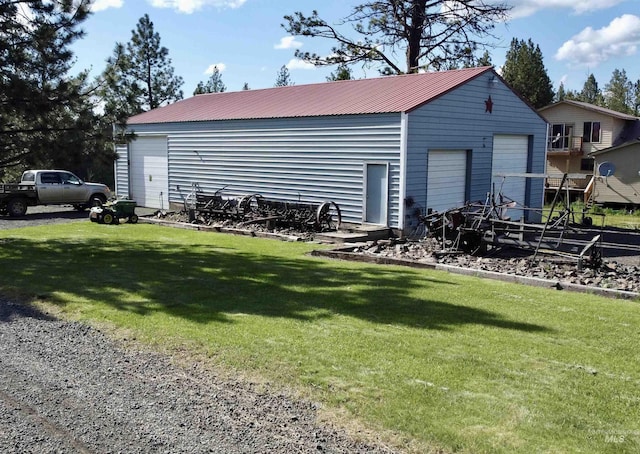 1223 Forest Rd, Winchester, ID 83555 - view of side of home with a garage, an outbuilding, and metal roof