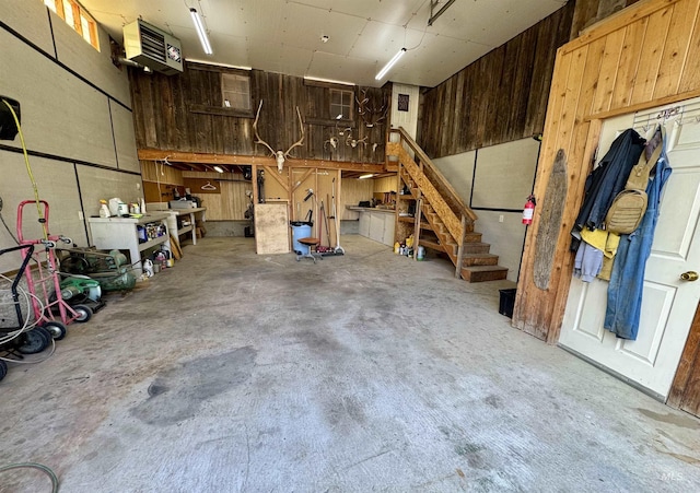 1223 Forest Rd, Winchester, ID 83555 - garage featuring a heating unit, wooden walls, and a workshop area