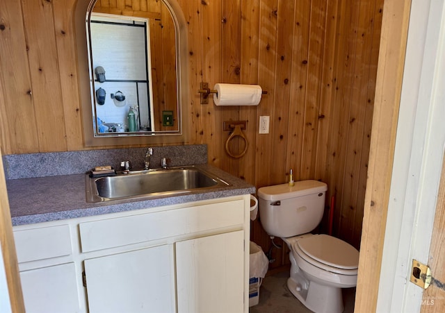 1223 Forest Rd, Winchester, ID 83555 - half bath with vanity, toilet, and wooden walls