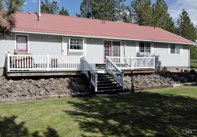 1223 Forest Rd, Winchester, ID 83555 - rear view of house with a wooden deck, metal roof, and a lawn