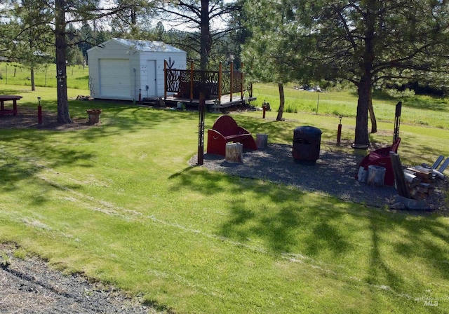 1223 Forest Rd, Winchester, ID 83555 - view of grassy yard with an outdoor structure and a wooden deck