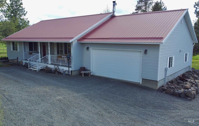 1223 Forest Rd, Winchester, ID 83555 - view of front of property featuring covered porch, an attached garage, and metal roof