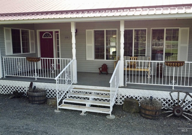 1223 Forest Rd, Winchester, ID 83555 - view of exterior entry featuring a porch and metal roof