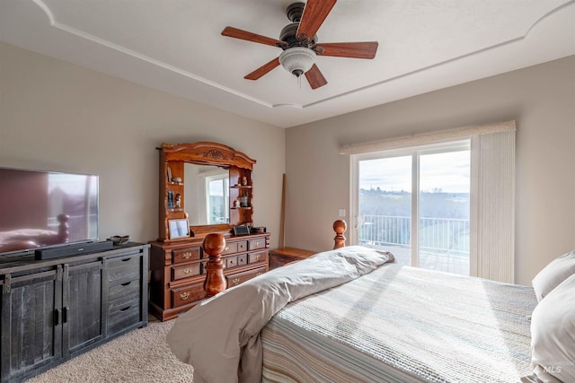 carpeted bedroom featuring access to outside and ceiling fan