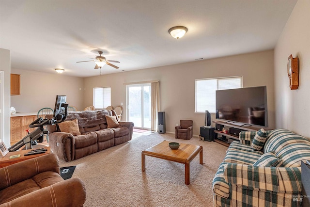 living room with light carpet and ceiling fan