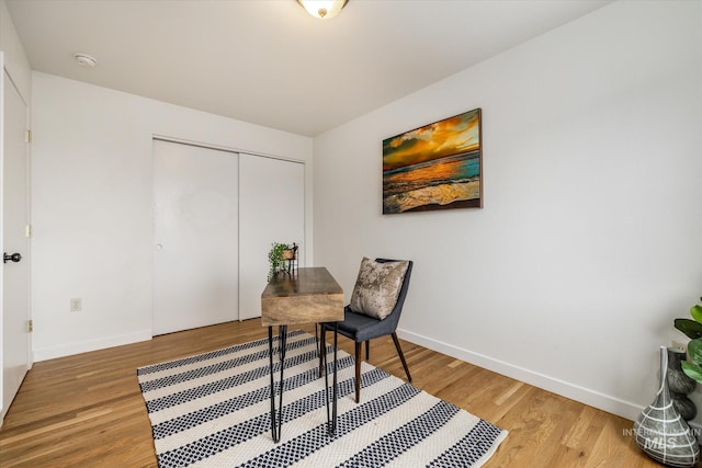 office space featuring light wood finished floors and baseboards