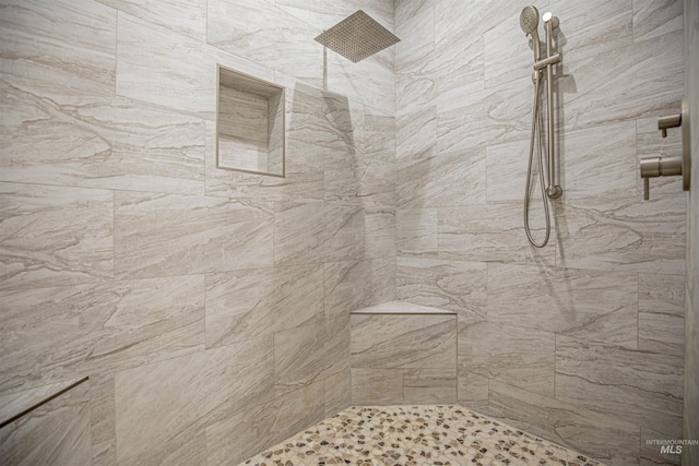 bathroom featuring tiled shower