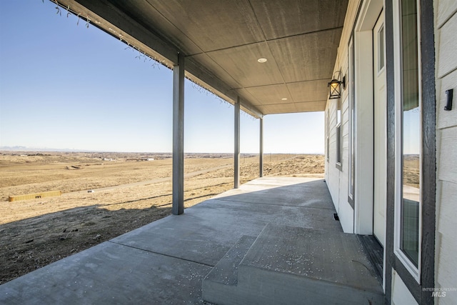 view of patio / terrace featuring a rural view