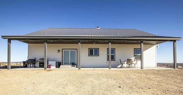 back of house with a patio