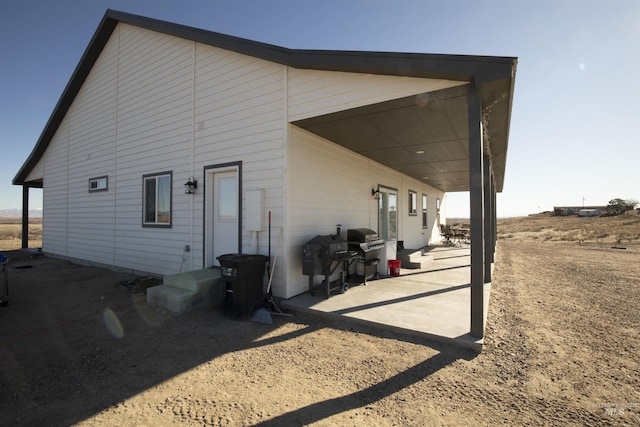 view of side of home featuring a patio area