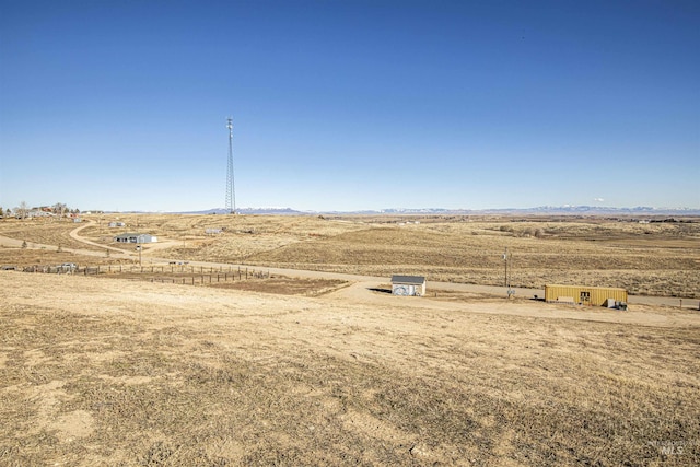 view of yard with a rural view