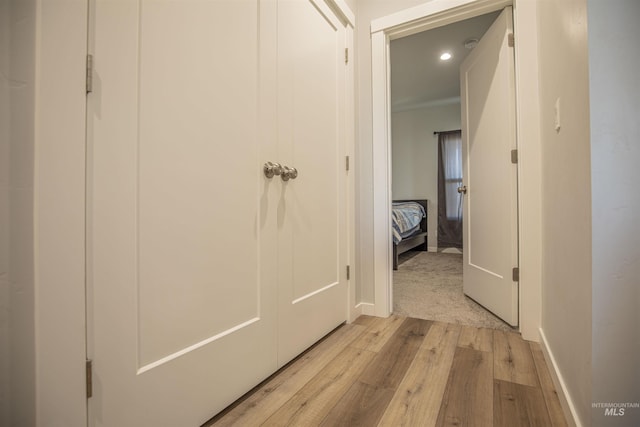 hall with light hardwood / wood-style floors