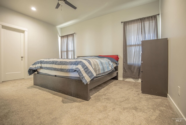 carpeted bedroom featuring ceiling fan