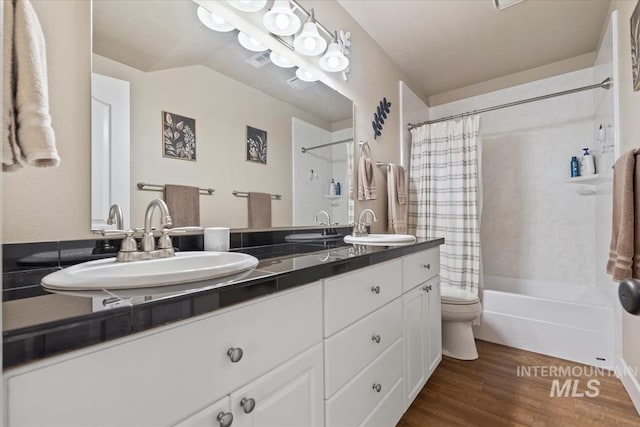 full bathroom featuring lofted ceiling, toilet, shower / tub combo, vanity, and hardwood / wood-style flooring