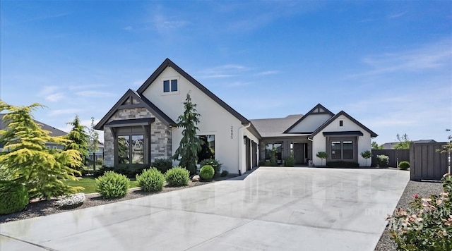 2685 N Fruniz Ave, Eagle, ID 83616 - view of front facade with stone siding, stucco siding, concrete driveway, and an attached garage