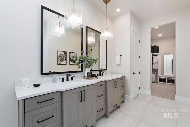 2685 N Fruniz Ave, Eagle, ID 83616 - full bath featuring double vanity, a chandelier, recessed lighting, tile patterned flooring, and a walk in closet