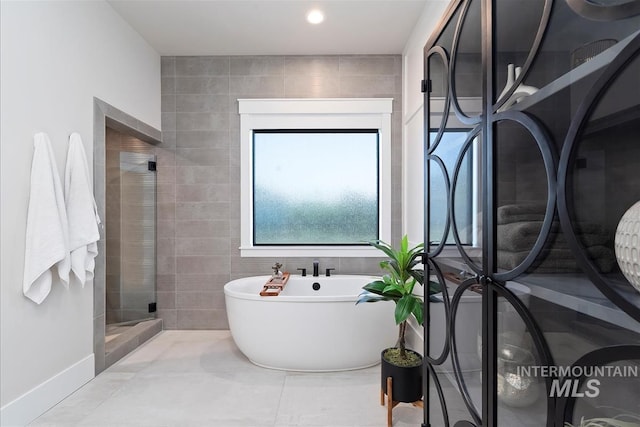 2685 N Fruniz Ave, Eagle, ID 83616 - bathroom with a soaking tub, a shower stall, tile patterned floors, and recessed lighting