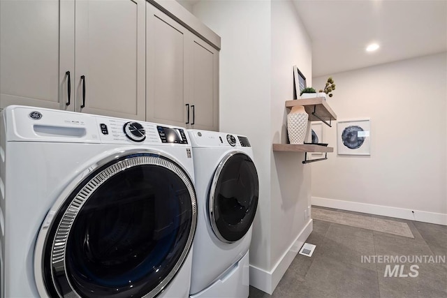 2685 N Fruniz Ave, Eagle, ID 83616 - laundry room with independent washer and dryer, cabinet space, recessed lighting, and dark tile patterned floors