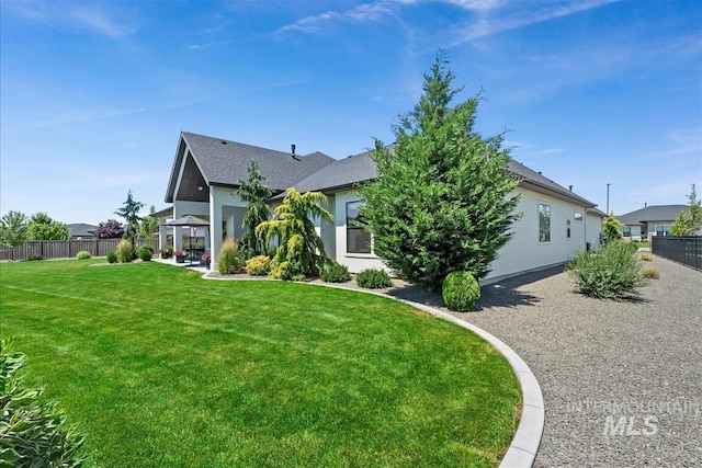 2685 N Fruniz Ave, Eagle, ID 83616 - view of front facade with a gazebo, a patio area, stucco siding, and a shingled roof
