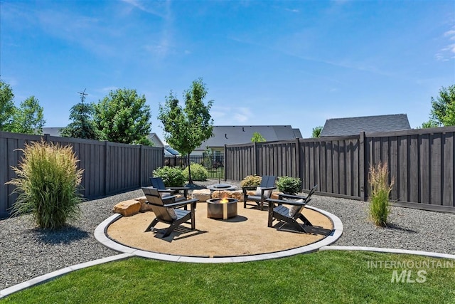 2685 N Fruniz Ave, Eagle, ID 83616 - fenced backyard with an outdoor fire pit and a patio
