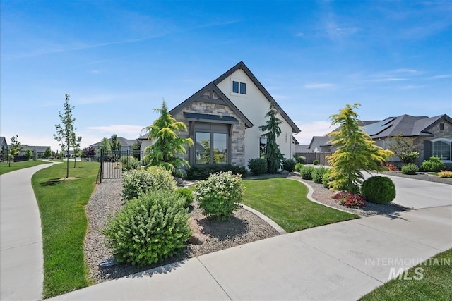 2685 N Fruniz Ave, Eagle, ID 83616 - view of front facade featuring stone siding, stucco siding, a gate, and a residential view