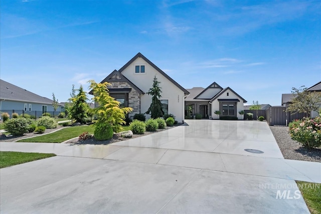2685 N Fruniz Ave, Eagle, ID 83616 - view of front facade featuring stone siding, stucco siding, and driveway