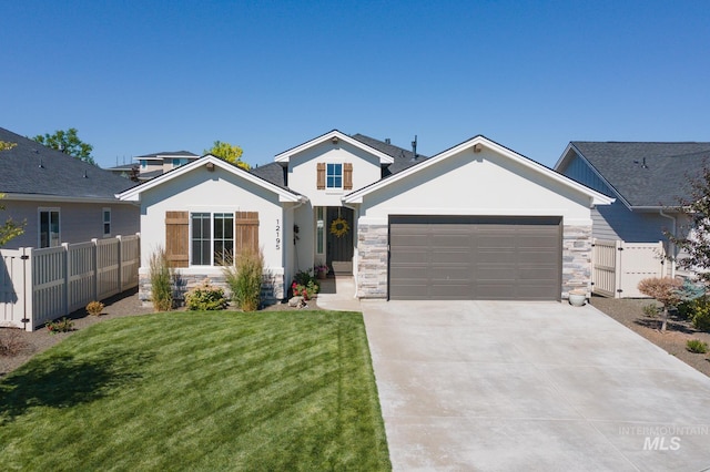 view of front of house featuring a garage and a front lawn