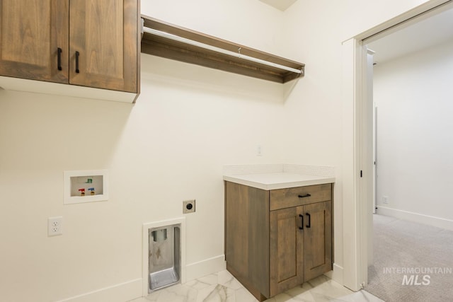 laundry room with cabinets, electric dryer hookup, and washer hookup