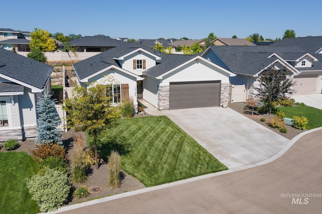 view of front facade featuring a garage and a front lawn