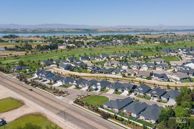 bird's eye view featuring a water and mountain view