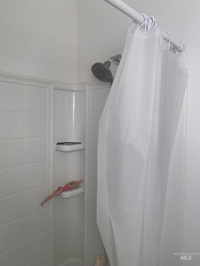 bathroom with a shower with curtain