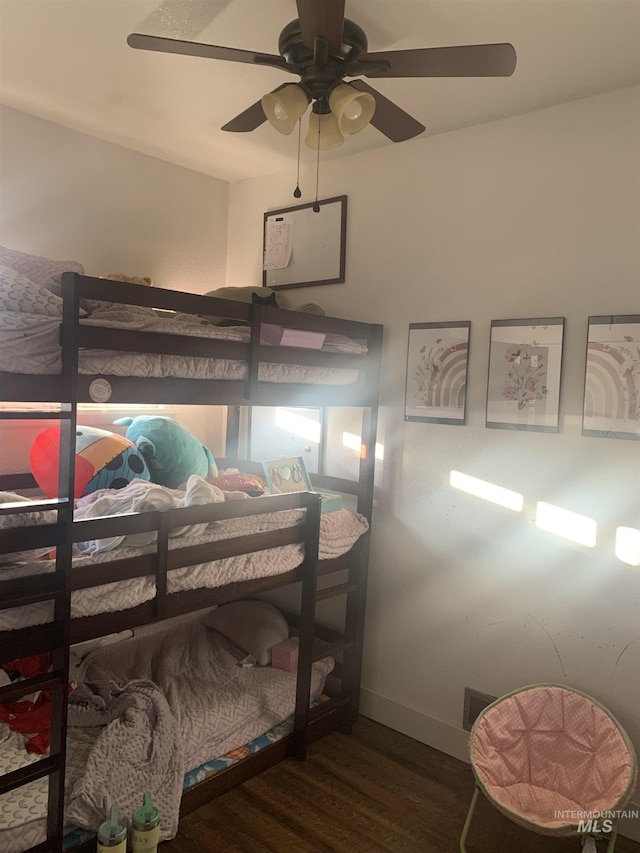 bedroom featuring dark hardwood / wood-style floors and ceiling fan