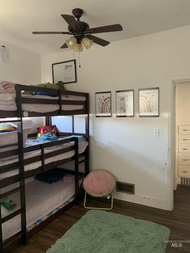 bedroom featuring dark wood-type flooring and ceiling fan